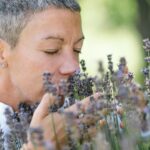 woman breathing in the scent of lavender